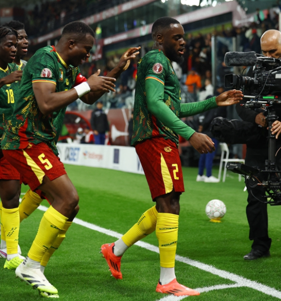 Cameroon players celebrate winning goal