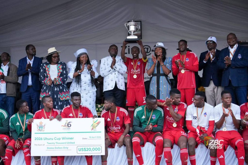 Knowledge Musona, the scorer of the Uhuru Cup-winning goal, lifts the cup